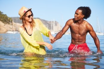 Romantic Young Couple Having Fun In Sea Together