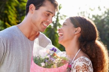 Romantic Man Giving Woman Bunch Of Flowers