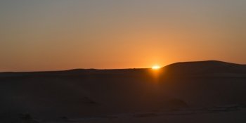 Sunset over Erg Chegaga Dunes in Sahara Desert, Morocco