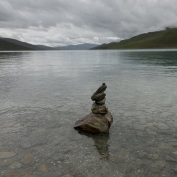Stack of stones in the Yamdrok Lake, Nagarze, Shannan, Tibet, China