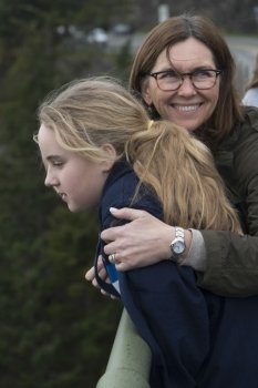 Woman smiling with her daughter, Deception Pass State Park, Oak Harbor, Washington State, USA