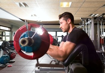 biceps preacher bench arm curl workout man at fitness gym