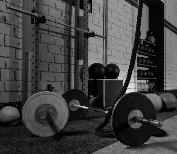 Barbells in a gym bar bells and rope at cross fit