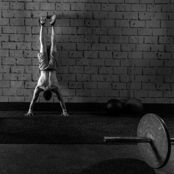 Handstand push-up man workout at gym pus ups