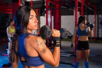 Gym women with hex barbell workout exercise