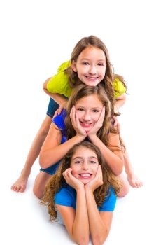 Three kid girls friends happy stacked in a row portrait on white background