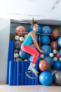 Kangaroo jumps anti gravity fitness boots girl at gym indoor