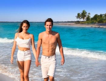 couple young tourists walking in a tropical Caribbean beach in Mexico photo mount