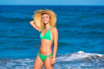blond tourist girl in a tropical summer beach happy vacations