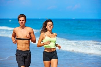 Couple young running in the beach in summer vacation