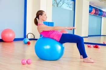Pilates woman fitball swiss ball exercise workout at gym indoor