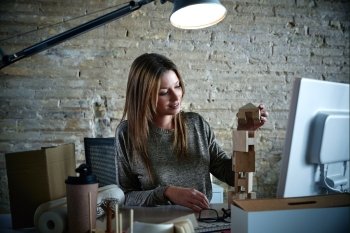 Businesswoman architect working at office with project and models