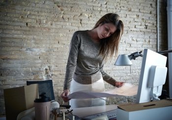 Architect engineer woman working with plan at office indoor