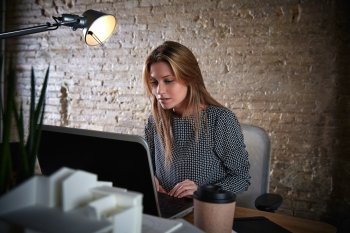 Businesswoman working with laptop computer at office