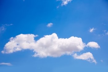 Single big cumulus cloud in blue summer sky