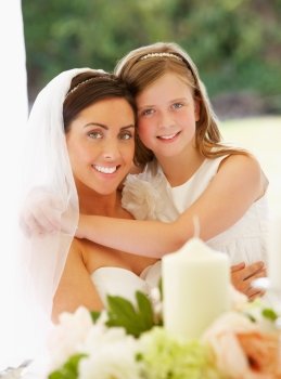 Portrait Of Bride With Bridesmaid In Marquee At Reception