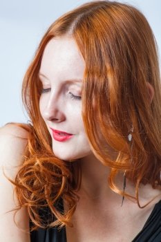 redhead in studio, closed eyes