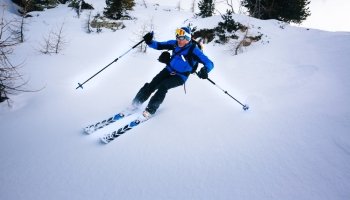 Winter sport: man skiing in powder snow. Val D’Aosta, italian Alps, Europe.