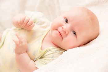 Two-month old baby girl on a light background
