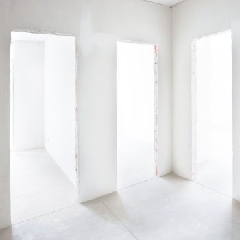 Three doors in white room. Empty interior