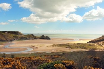 A view of Three Cliffs Bay on the Gower Peninsula in South Wales, UK