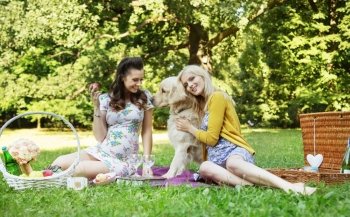 Portrait of the cheerful girlfriends hugging friendly dog