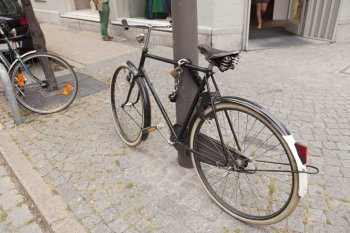 Bicycle parked on pavement in Brussel, Belgium
