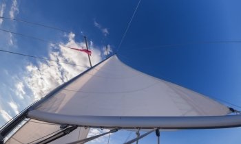 Rigging, ropes, shrouds and sail crop on the yacht
