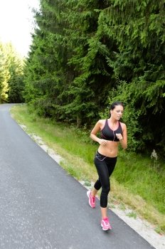 Athlete woman training for marathon run jogging outdoor in countryside