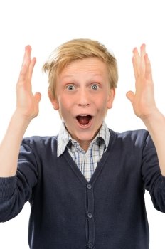 Surprised teenage boy screaming thrilled against white background