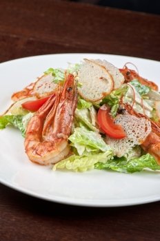 Tasty shrimp salad with vegetables on christmas table. Tasty shrimp salad