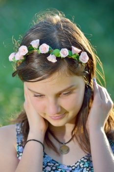portrait beautiful girl with wreath of flowers