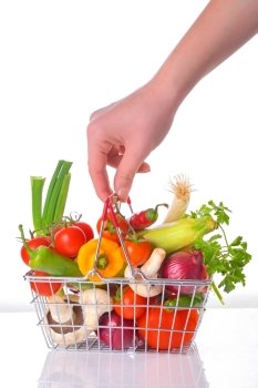 Assortment of fresh vegetables in metal basket
