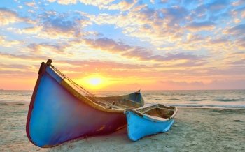 Fishing boats and sunrise on Black Sea