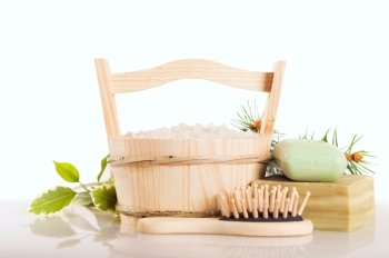 Aromatic bath salt in wooden bucket and handmade soap