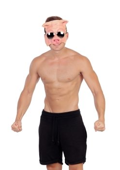 Muscular man with a pig mask on a white background