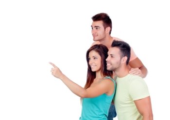 Pretty girl indicating something with two handsome boys isolated on a white background