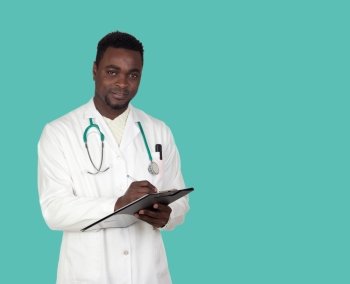 African american doctor with a clipboard on a over green background