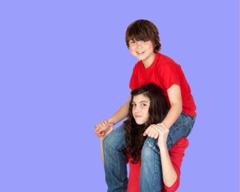 Boy riding on his sister on a blue background