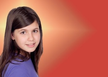 Adorable preteen girl with a orange and yellow background