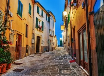 Narrow old street in Italy at night