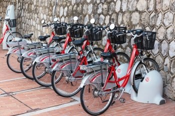 Row of electric bicycles in the parking lot