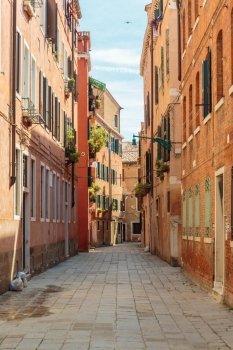 Narrow street in the old town in Venice Italy