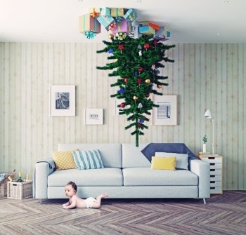 room with a Christmas tree on the ceiling and surprised baby. photo-combinated concept
