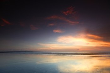 Radiant sea beach sunset on Bali. Bali sunset