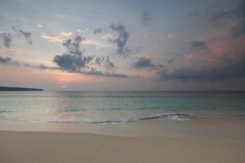 Bali beach sunset. Beautiful Bali sunset with reflection in beach sand