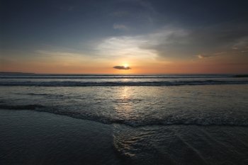Beautiful sunset by the ocean in Bali. Beautiful sunset in Bali