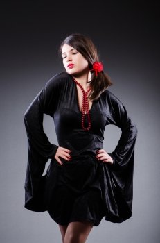 Young attractive woman dancing flamenco