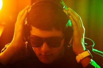DJ mixing music at disco