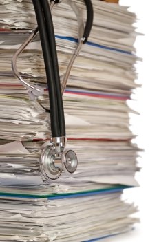 Stack of papers with stethoscope